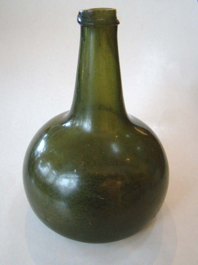 A late 17th century hand blown wine or port bottle circa 1690